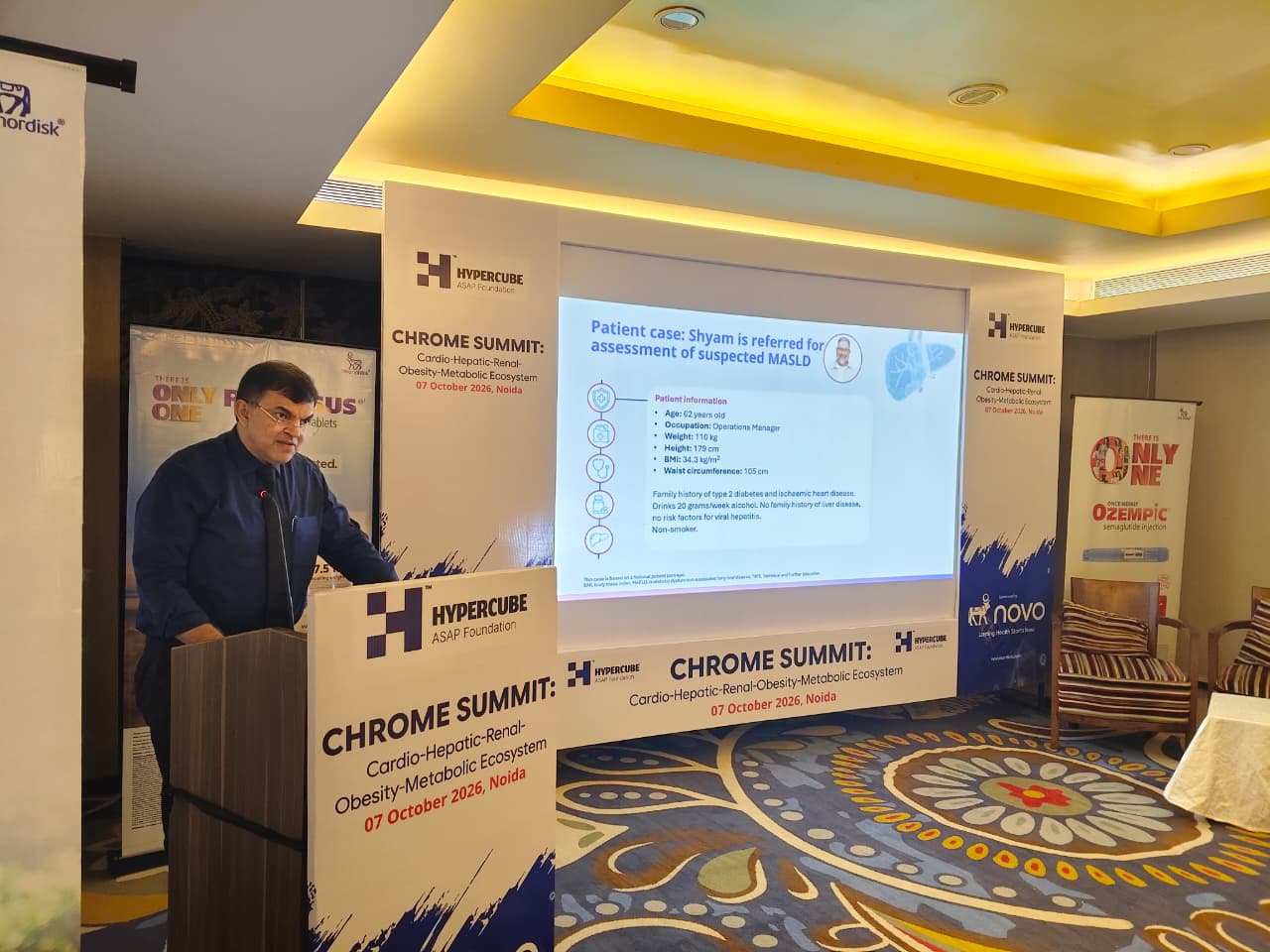 Speaker presenting a MASLD patient case at the Chrome Summit 2026 podium under the Hypercube ASAP Foundation banner