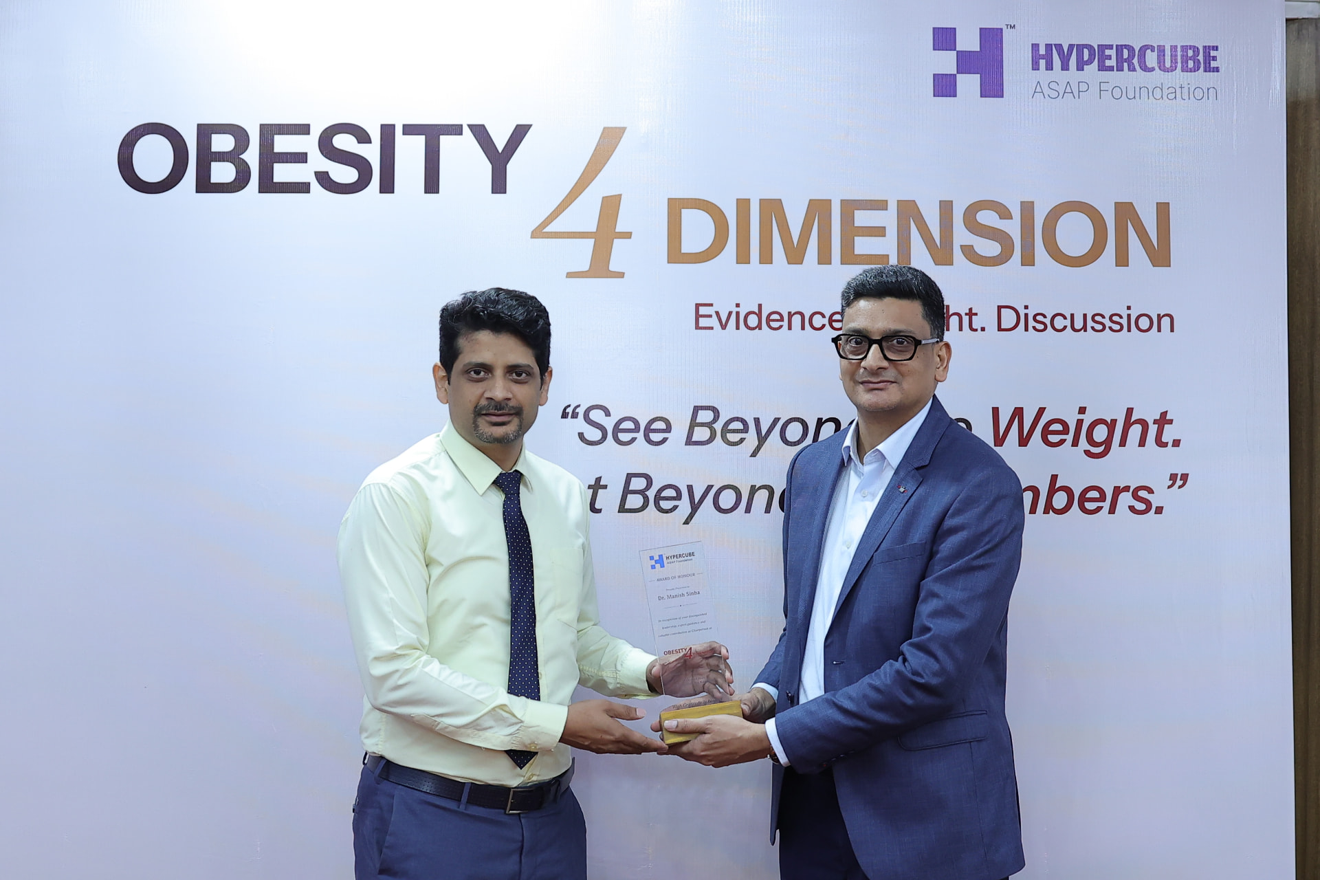 Award of Honour being presented in front of the Obesity 4 Dimension backdrop